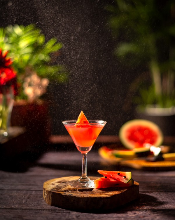 wing glass with watermelon on the wooden round