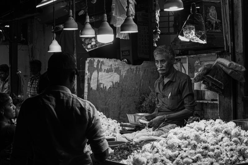 a flower seller busy with his-purchases sanal thrissur creativehut