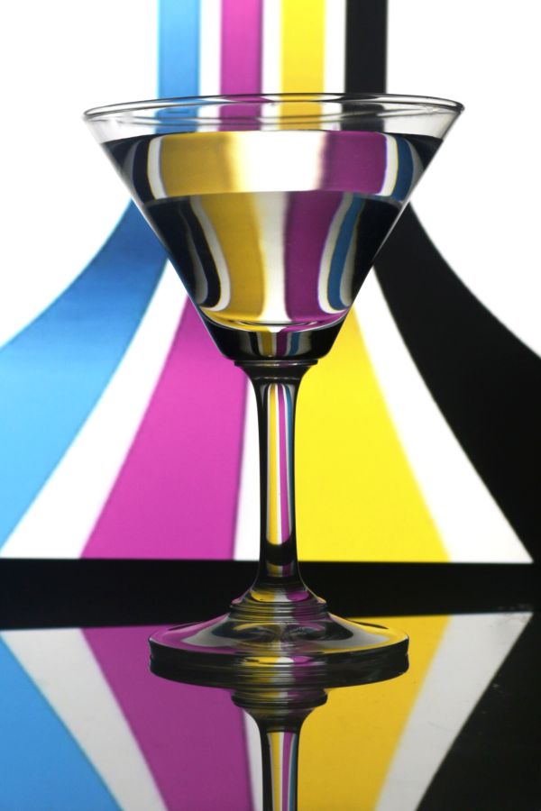 wine glass with water on lined background