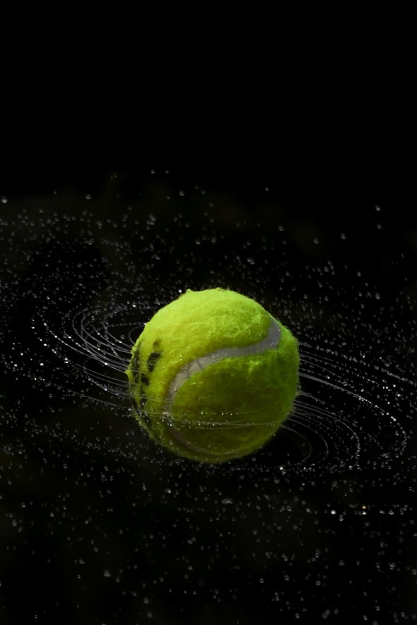 green ball in black background