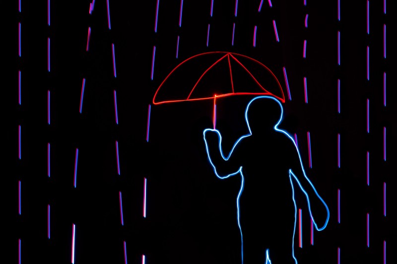 a man with umbrella in rain