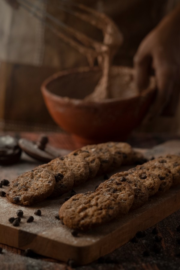 bake chocolates in a clay bowl and bisuits near it