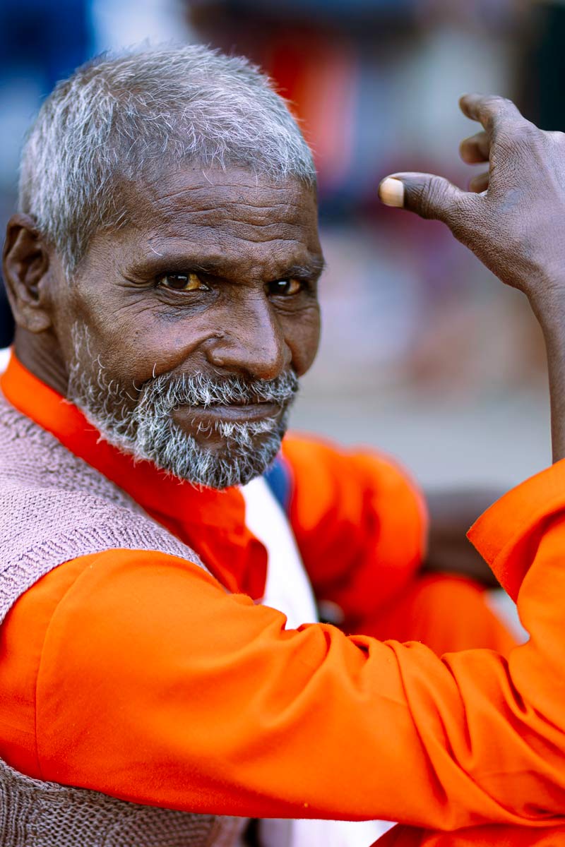 old sadhu looking in camera with smile