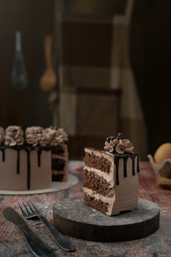 a piece of cake on a round wood 