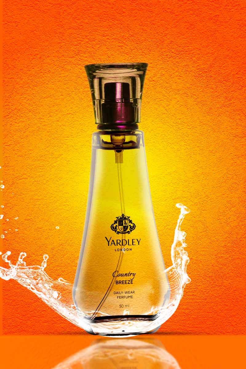 Yardley London country breeze perfume with water splash in orange background