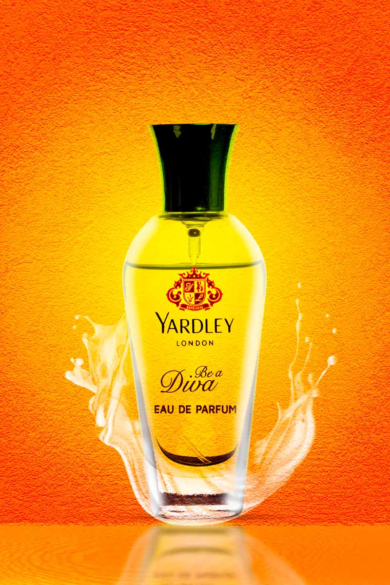 Yardley London be a diva perfume with water splash in orange background