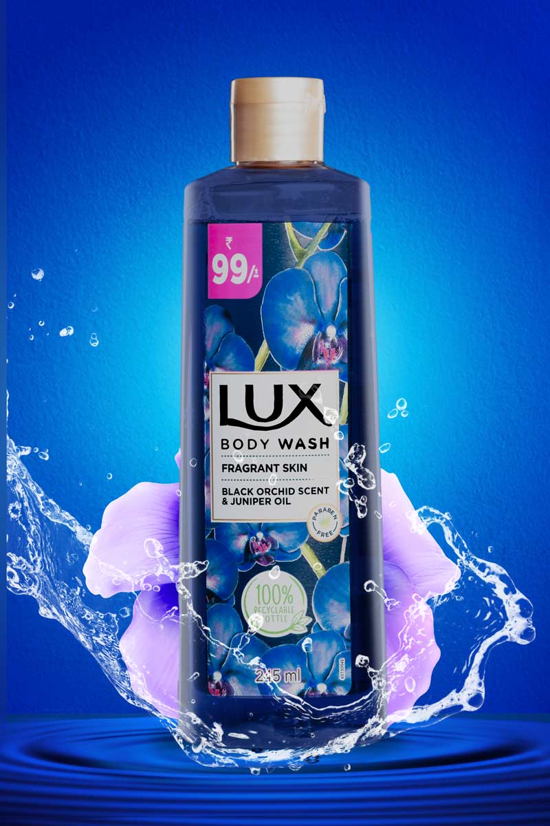 lux body wash with water splash in blue background