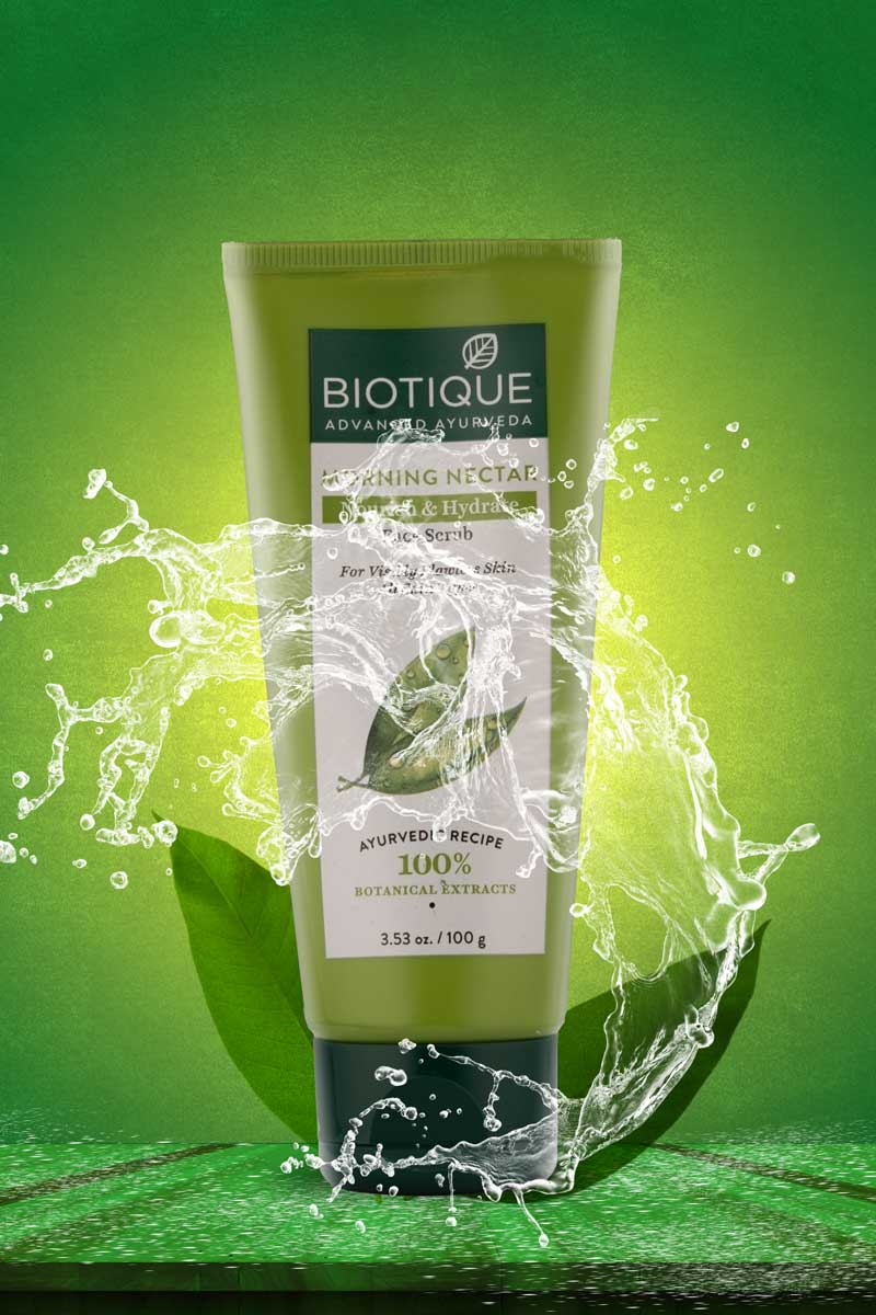 Biotique Face scrub with water splash in green background