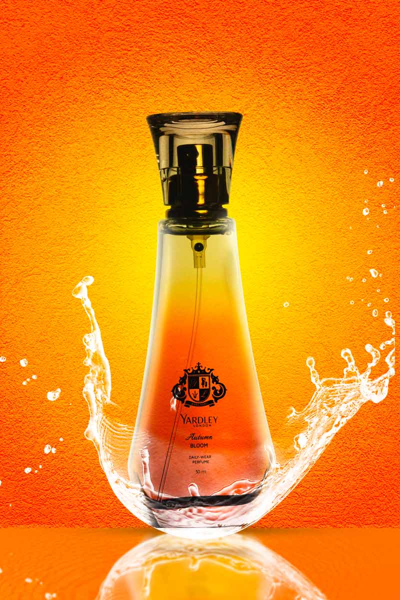 Yardley London Autumn Bloom Perfume with water splash in orange background