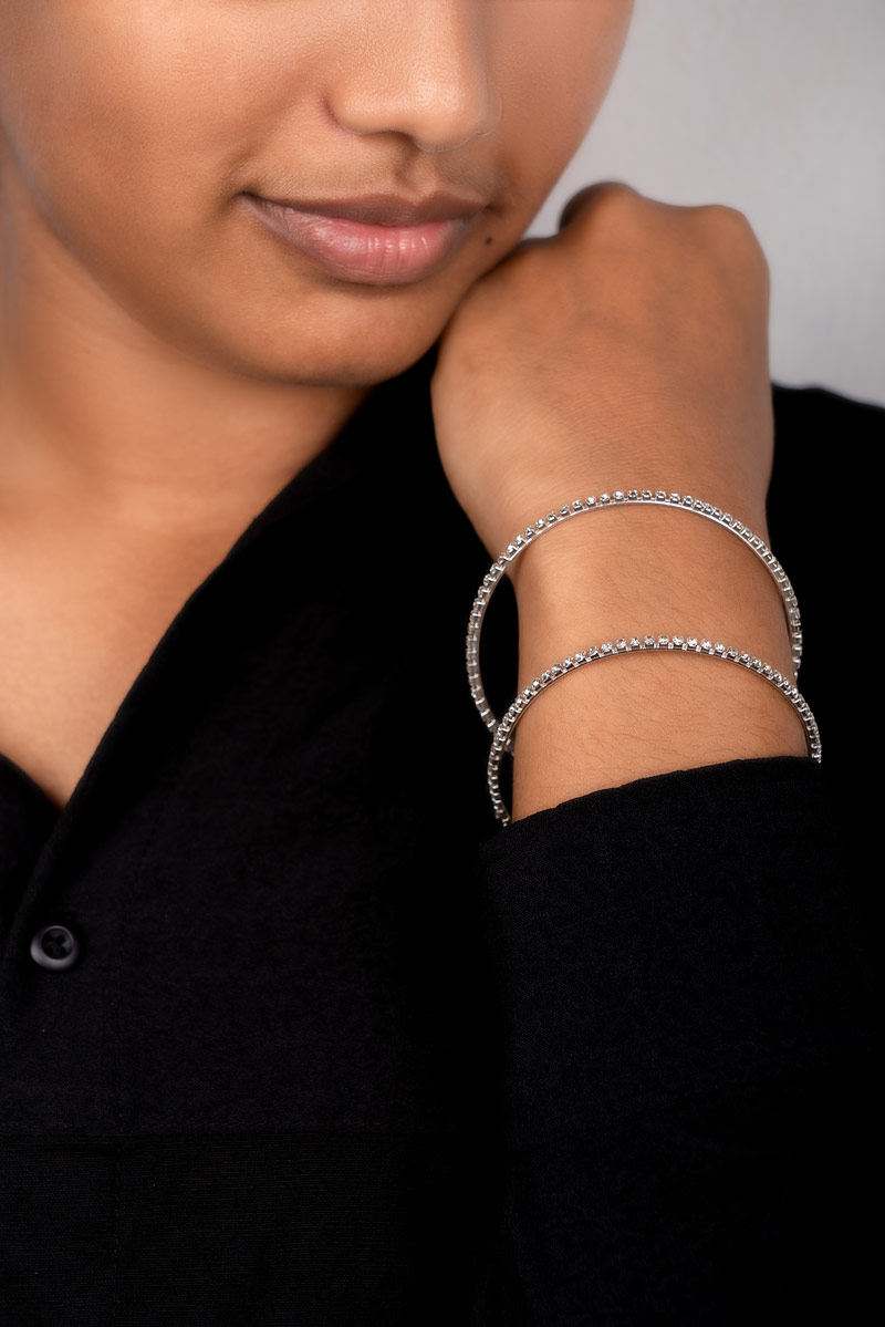 Silver bangles in hand.