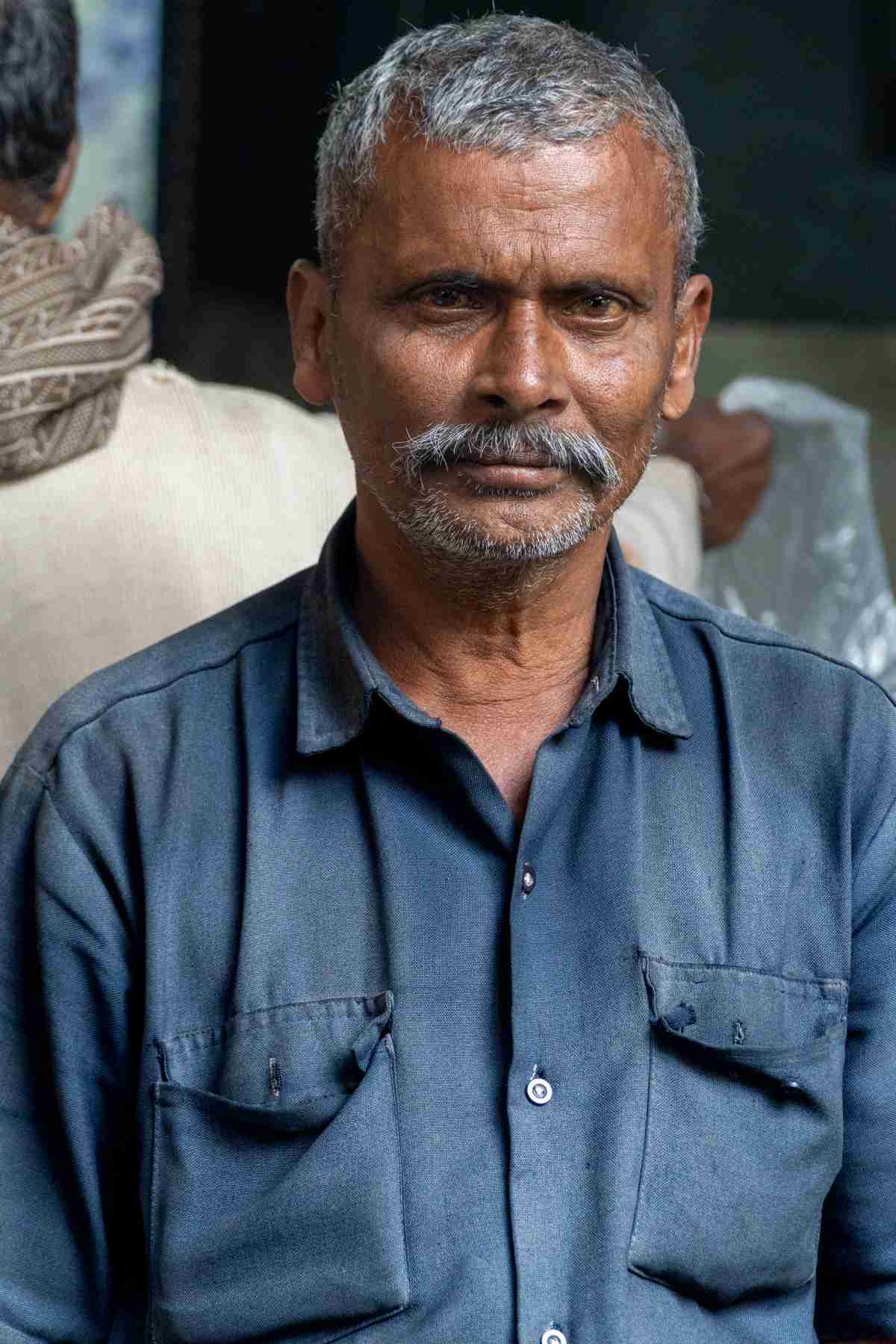 Old man with blue shirt