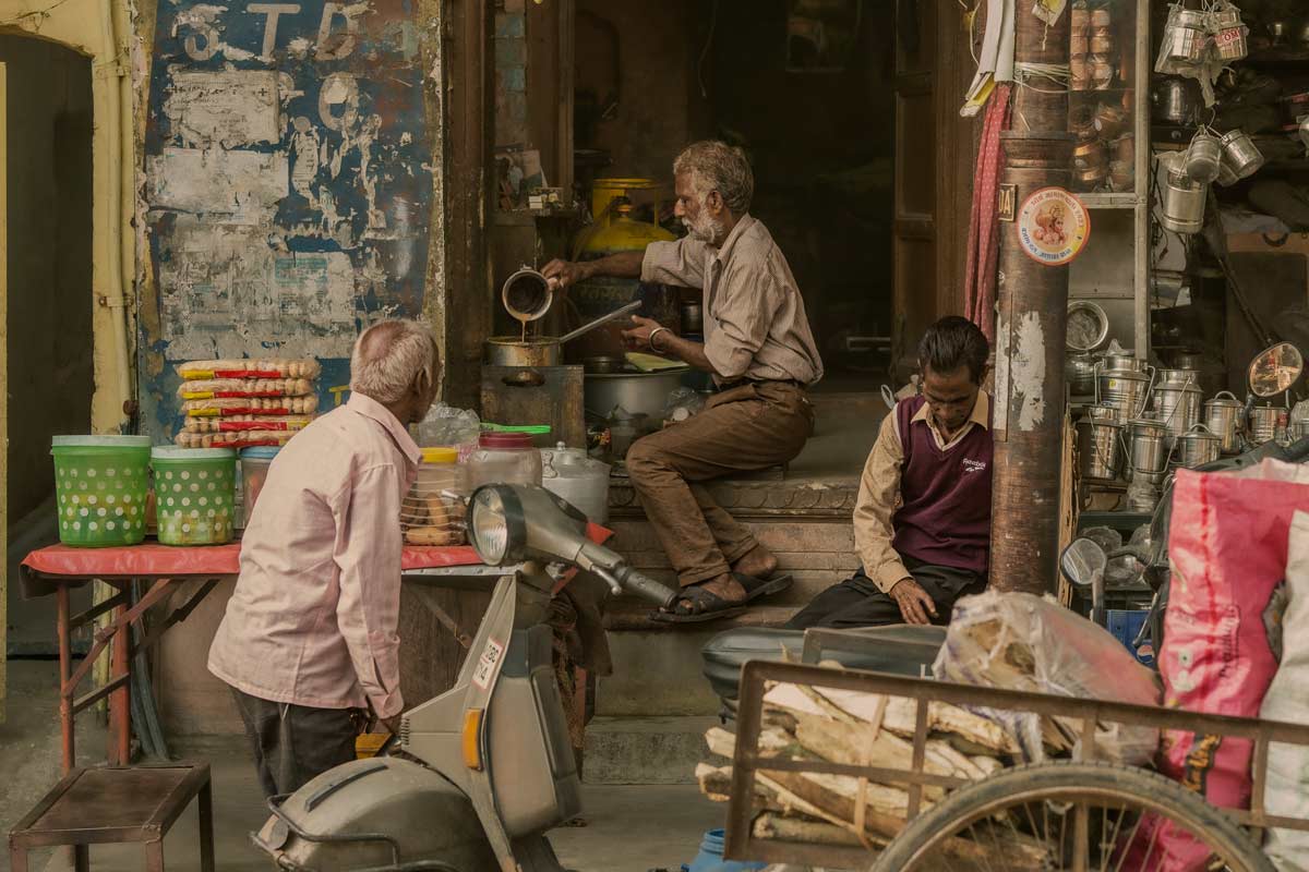 a old man is making chai old guys