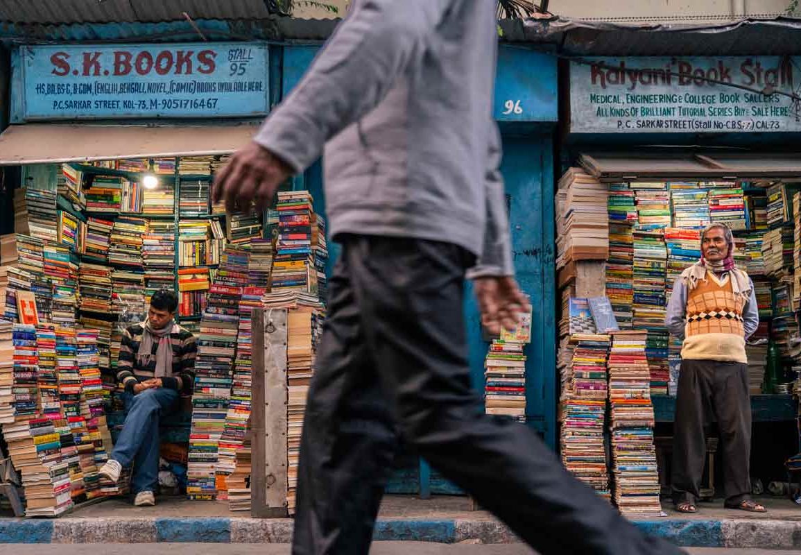 A man walking through book stores that refuge for readers