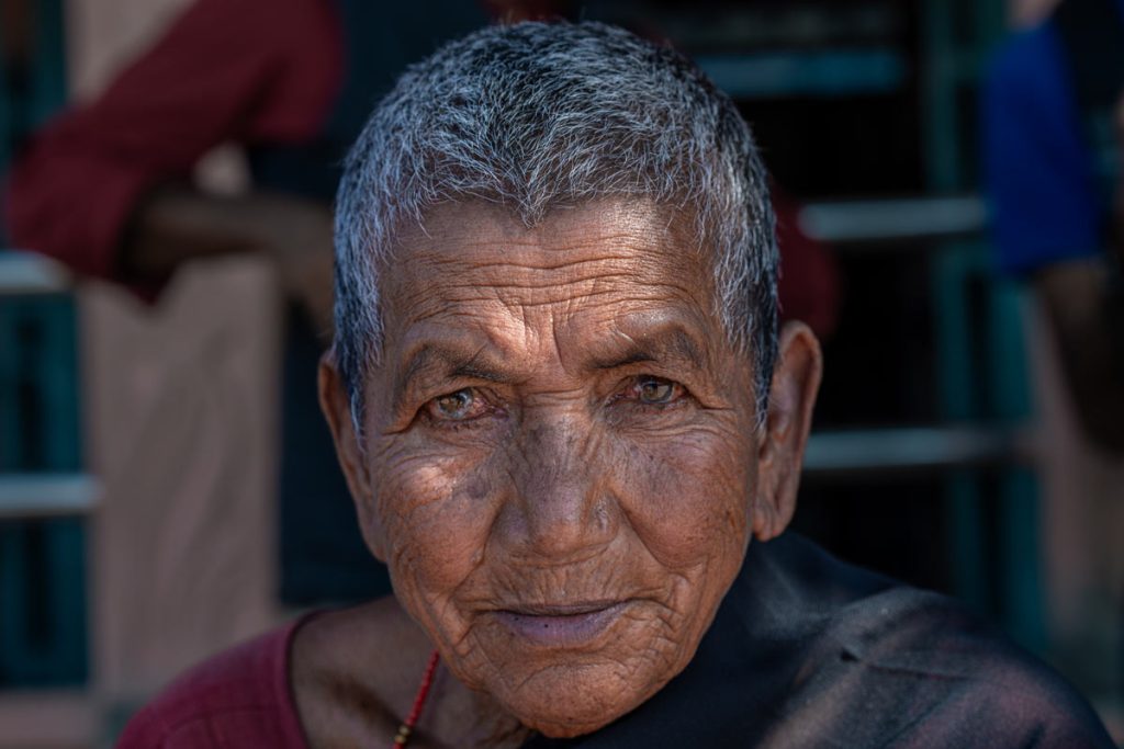 a aged woman is with unique eyes