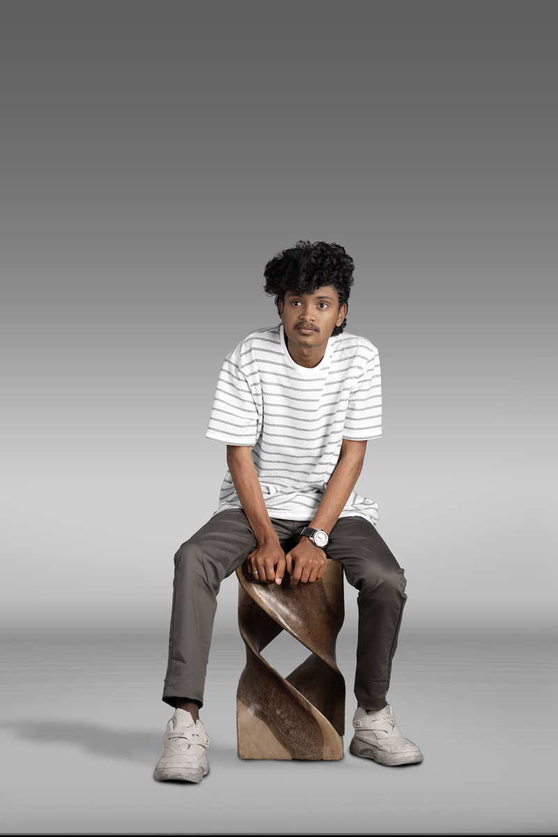 boy sitting on a stool
