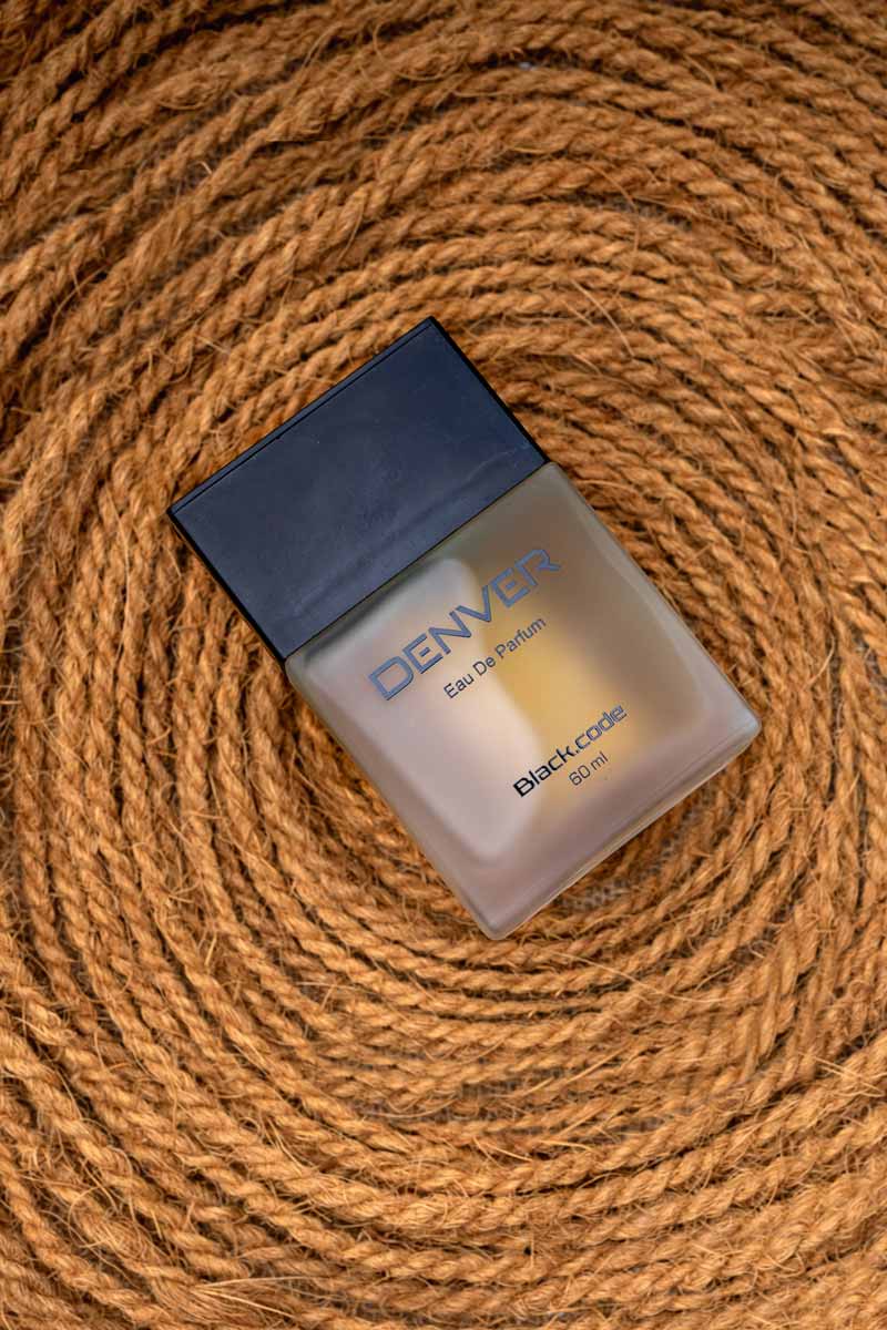 A denver perfume on rope background.