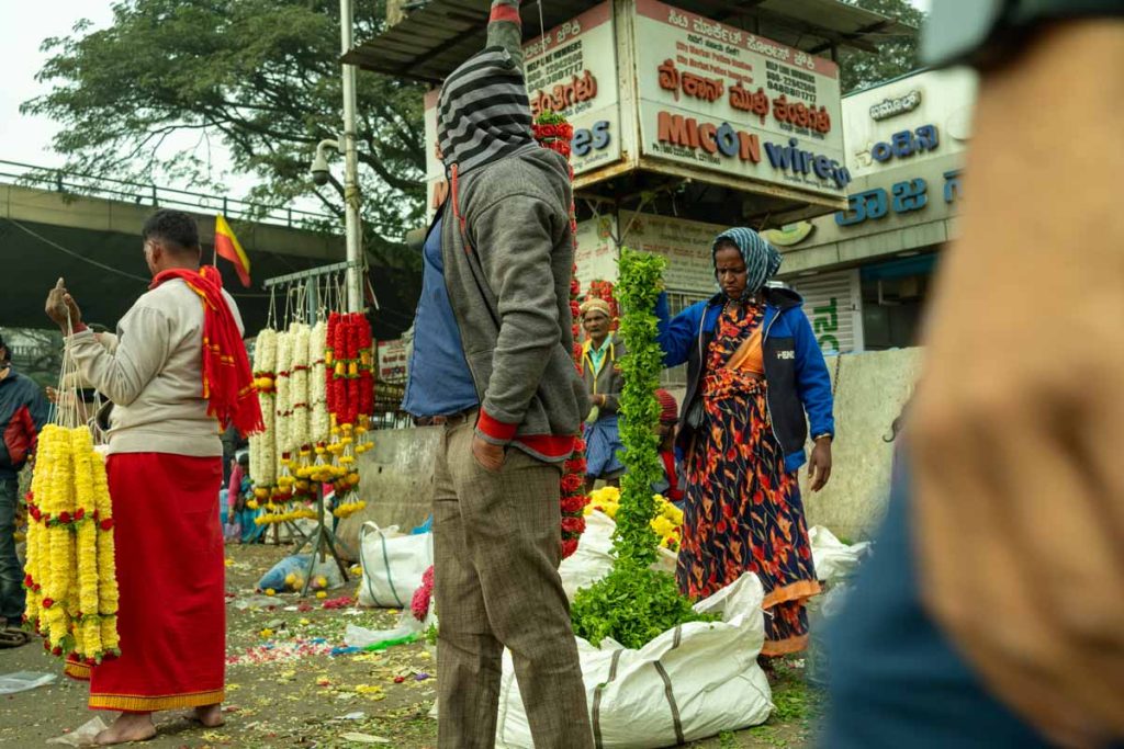 A picture of lady's selling in flower market.