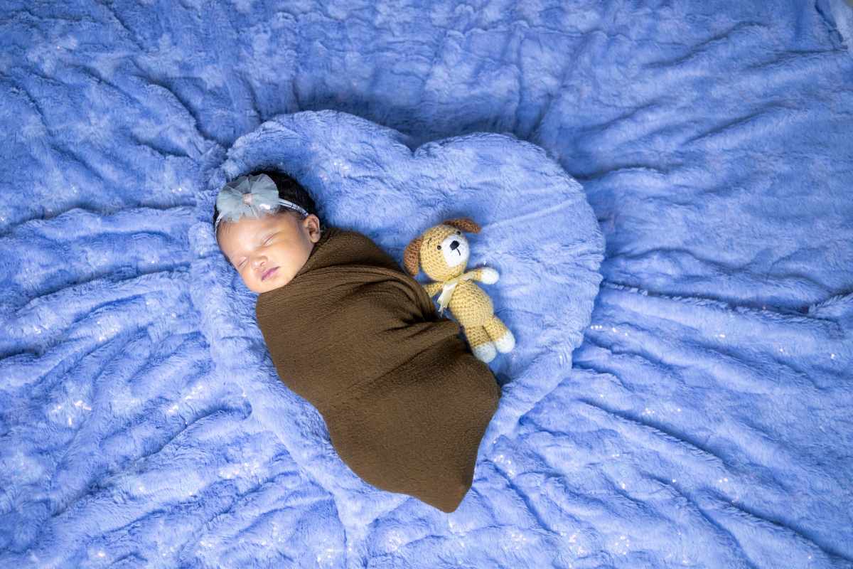 baby sleeping with her toy