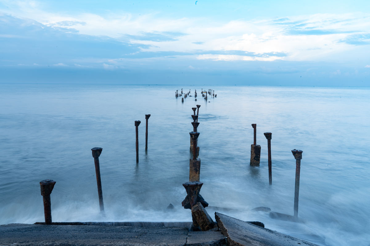 broken bridge leading to the horizon