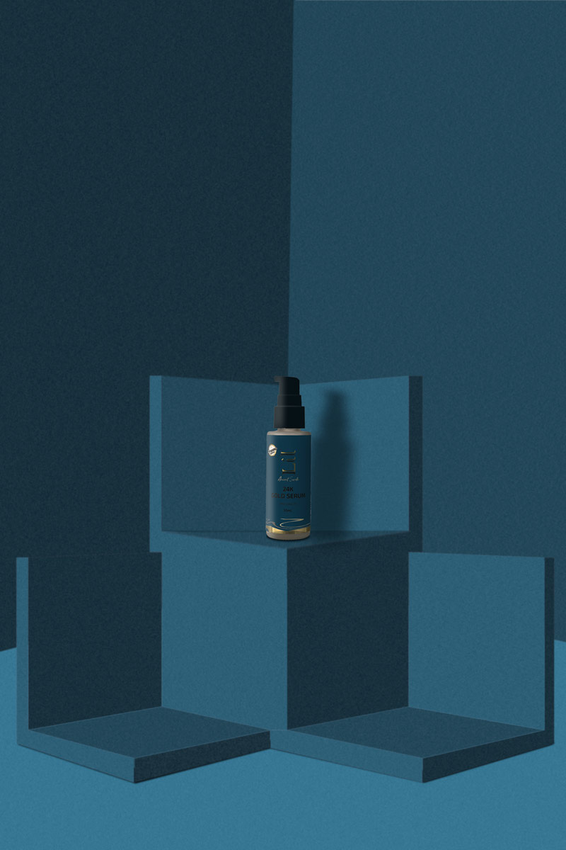 gold serum placed on a blue background