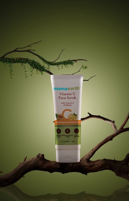 Natural facial glow scrub placed on a wooden branch