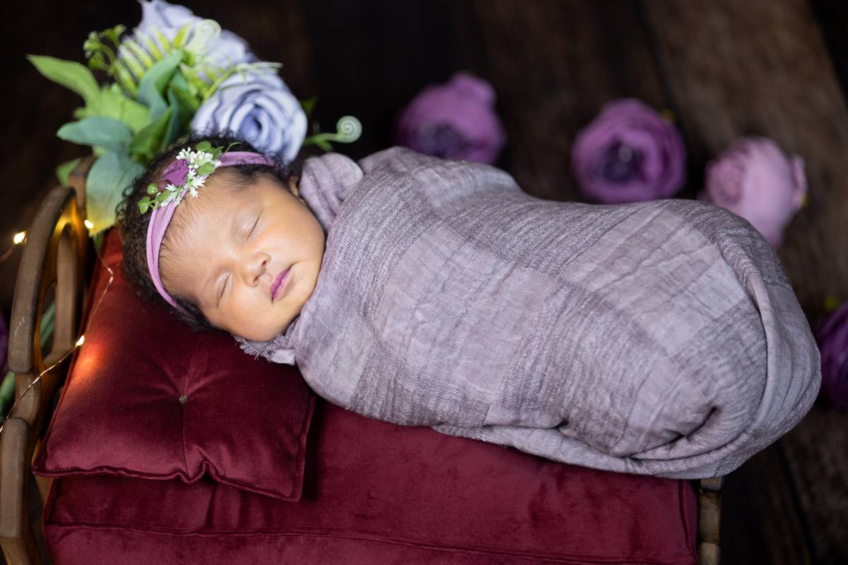 baby wrapped in gray blanket