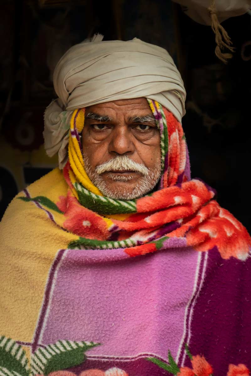 old man cover himself with blanket