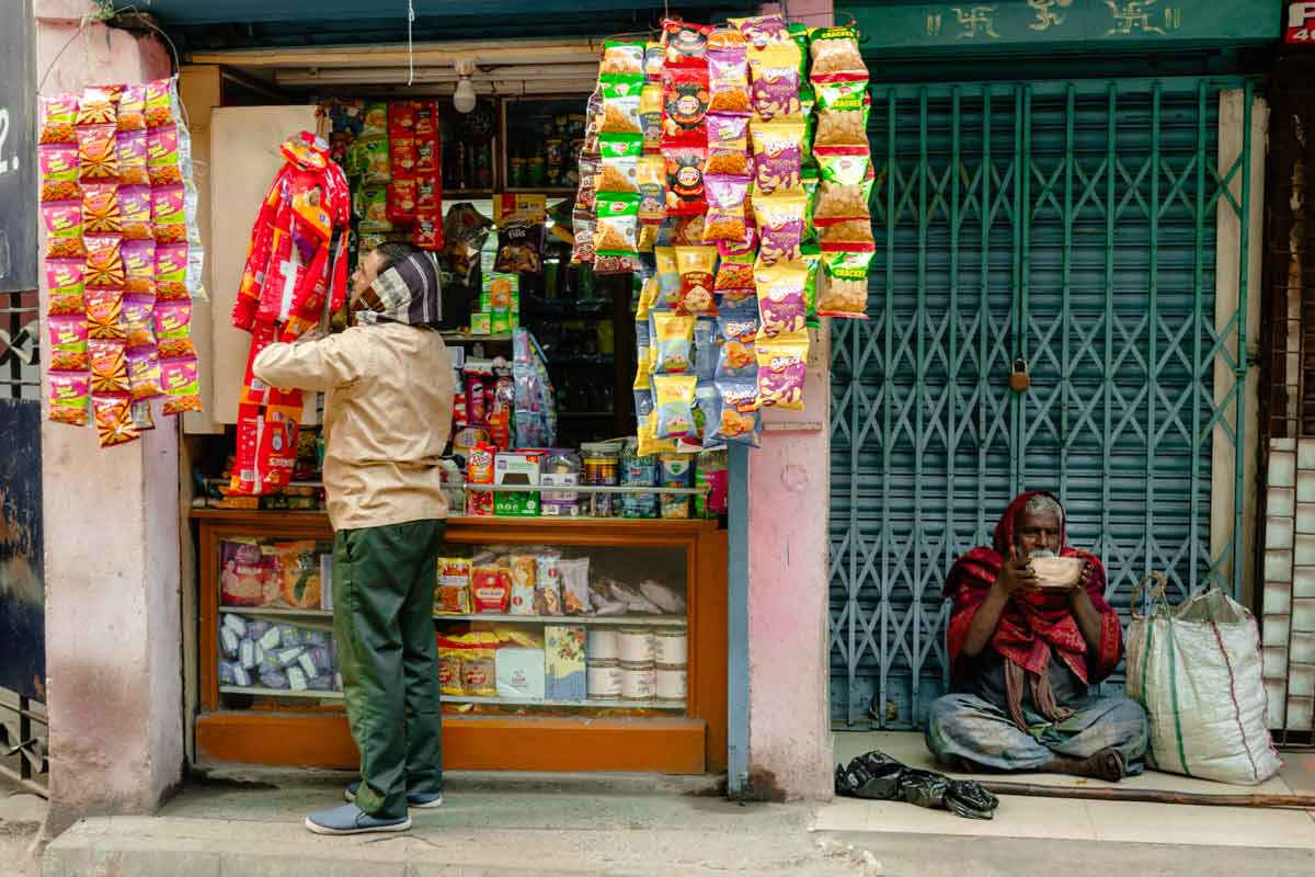 contrasting scenes in front of shop