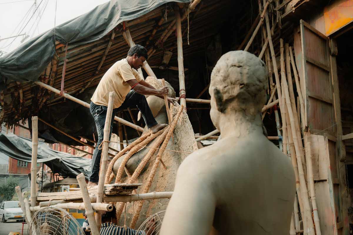 man sculpting a sculpture