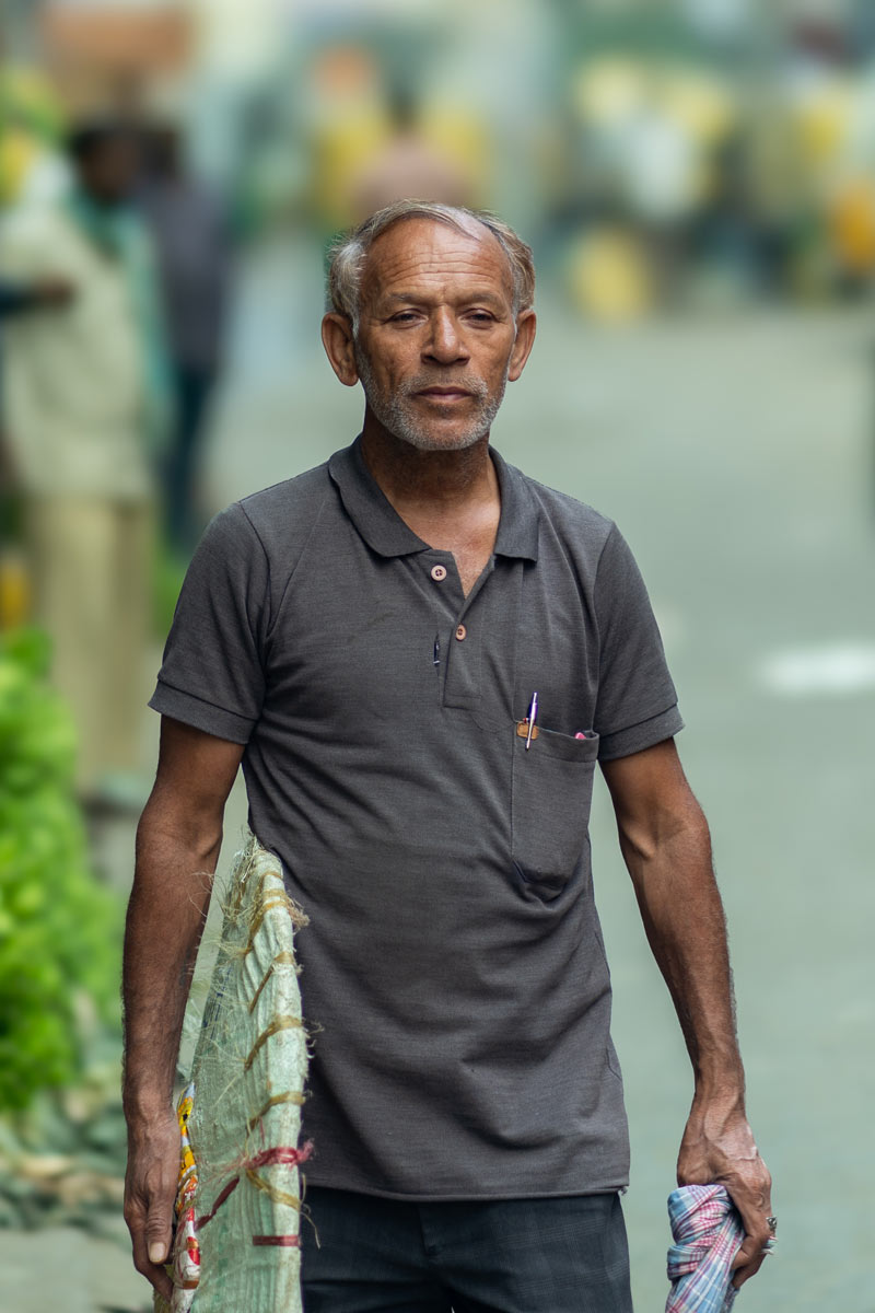 A photo of a old man in streets.