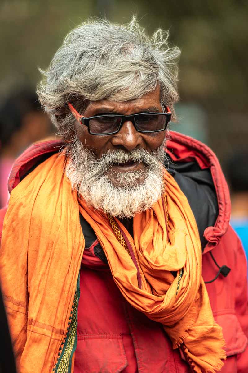 Oldman walking with swag