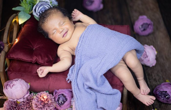 cute baby smiling and sleeping