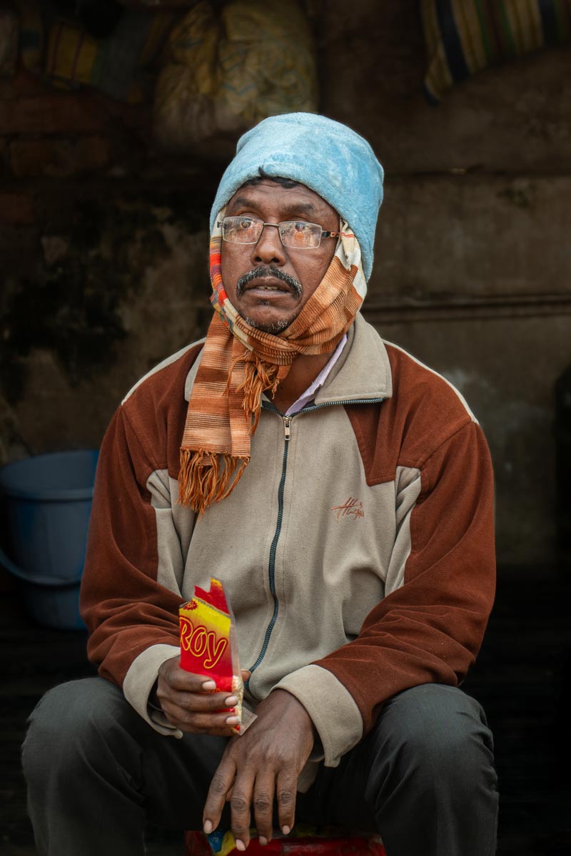 man eating snacks during work