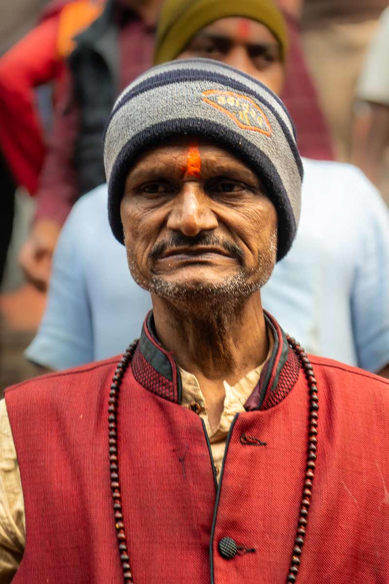 man with orange tilak