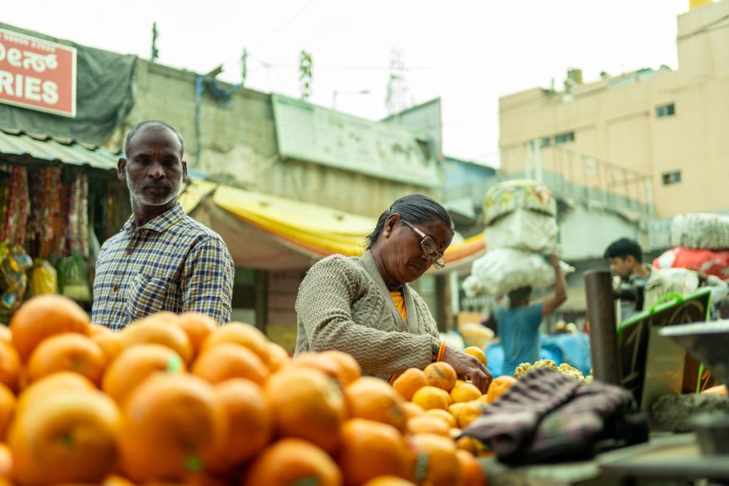 A photo of picking up fruits in market.