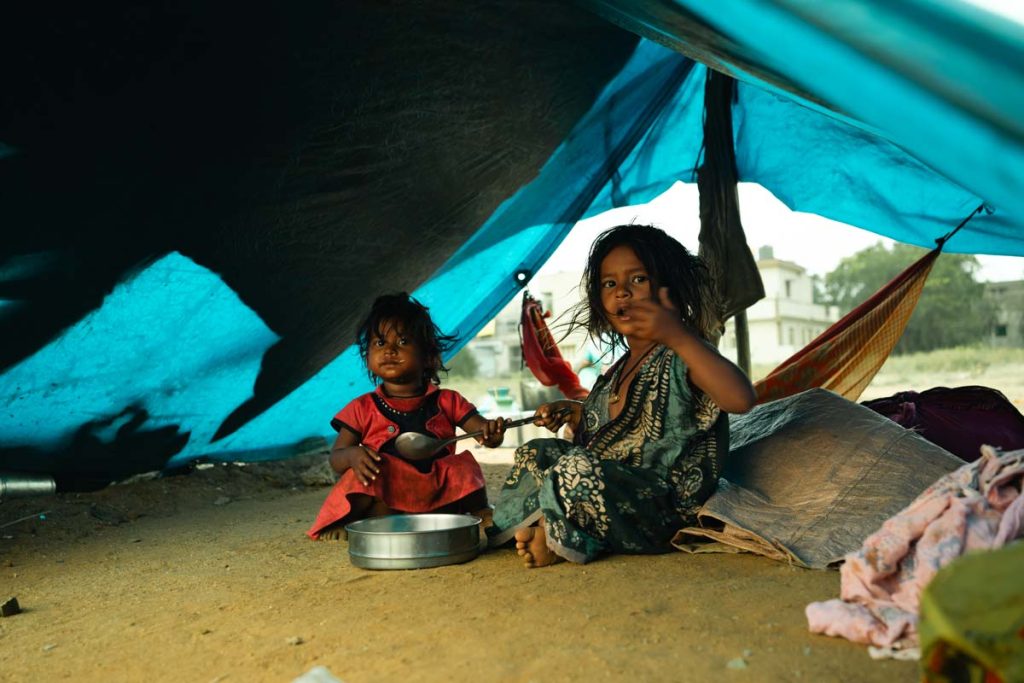 A photo of two kids having food.