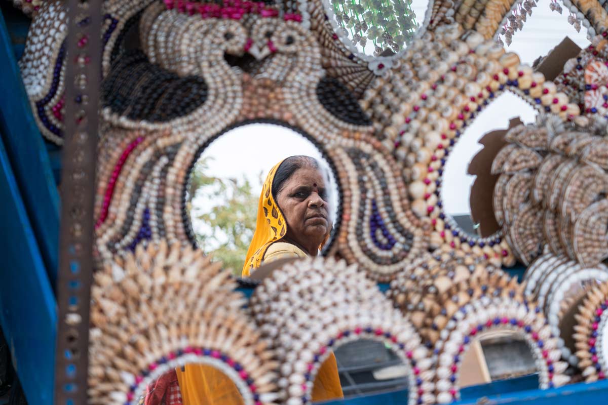 a lady looking at the mirror