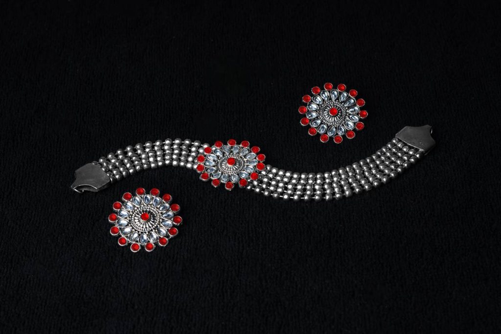 the anklet with red diamonds