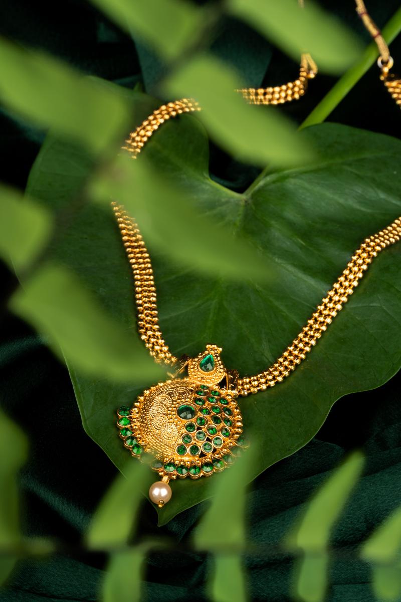 Jewelry with big leaf.