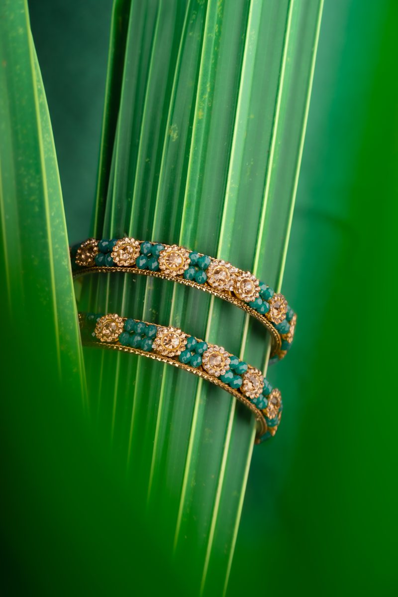 A bangles photo with coconut leaf.