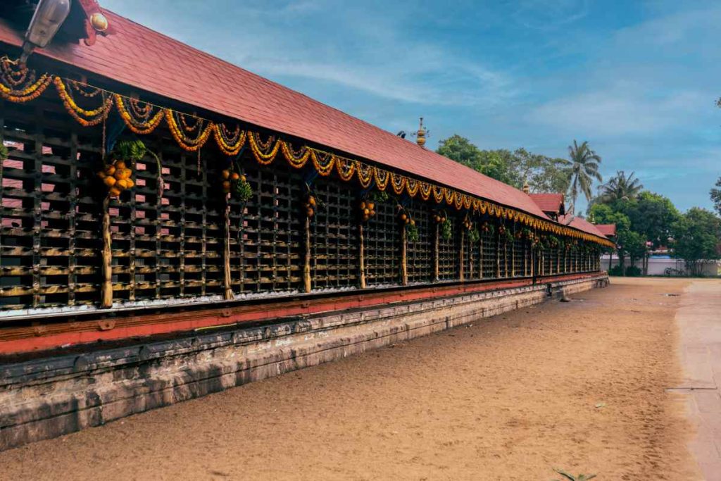 Decorated temple corridor view.