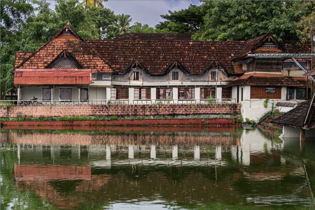 A temple beside the pond's peaceful shore.