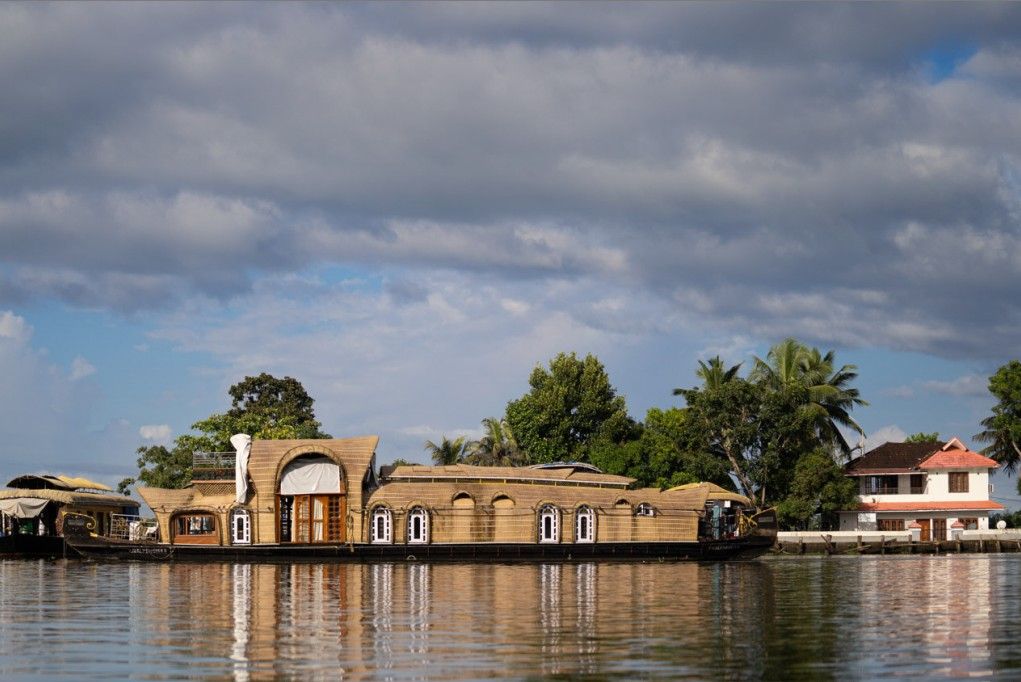 A house boat is sailing peacefully