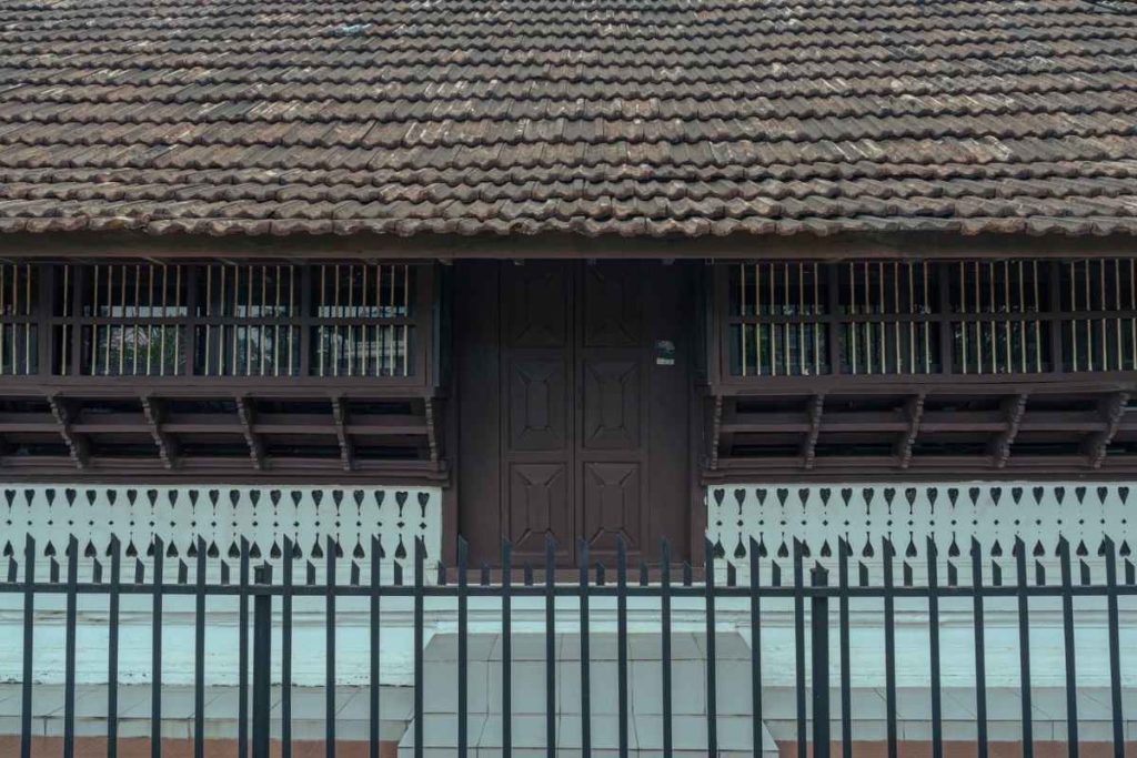 wooden carvings of a house.