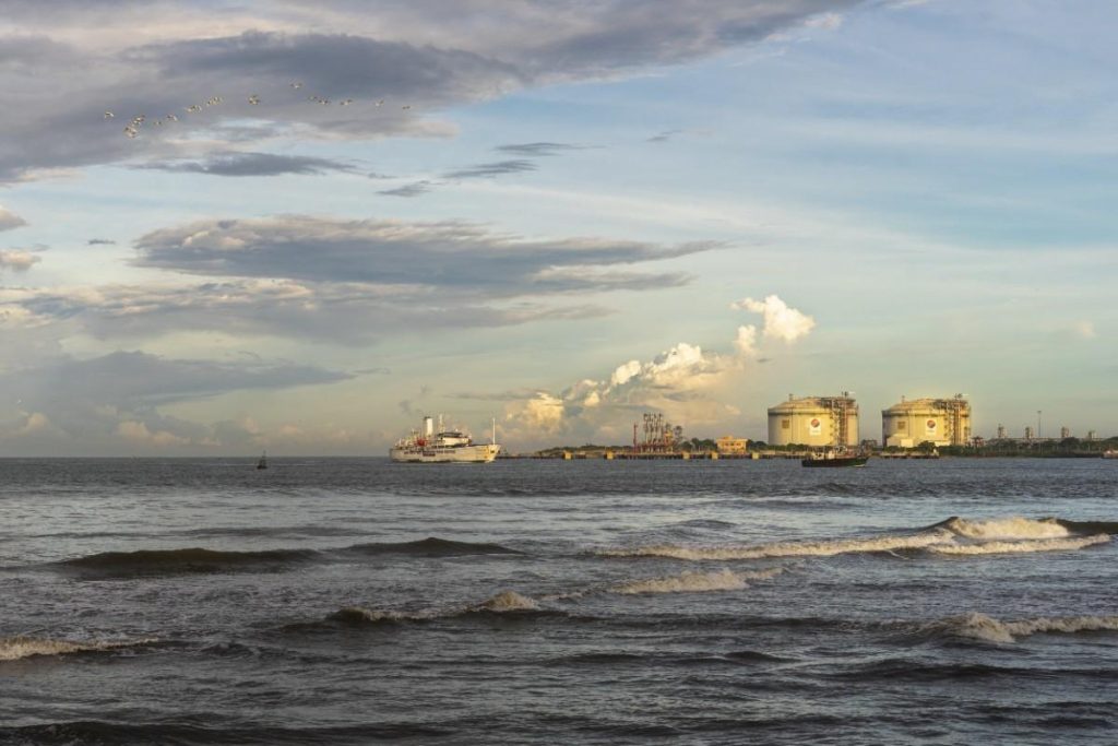 A ship moving through the beachside.