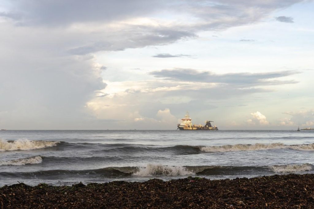 A ship moving across the sea.