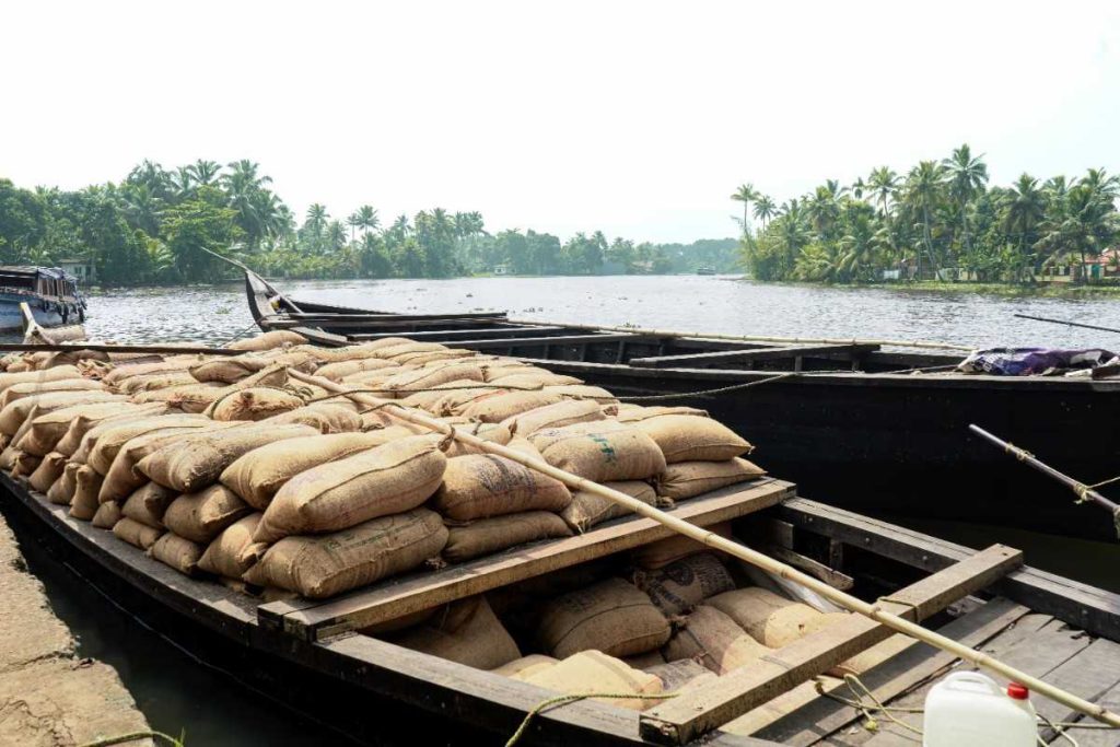 Water’s Edge A boat loaded with rice sacks docked near the shore.