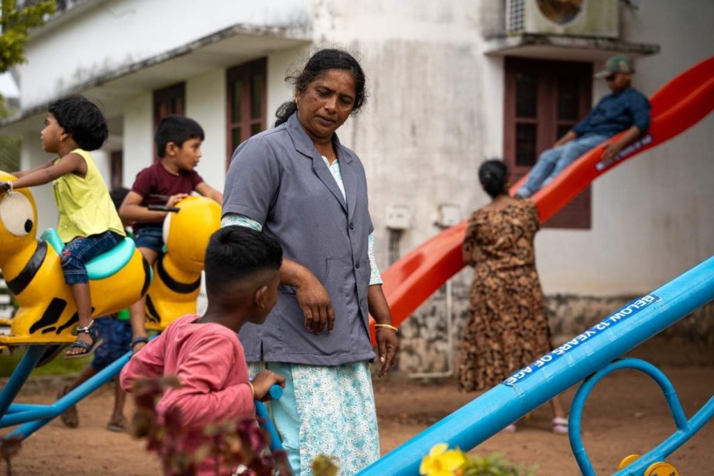 : Playful Freedom – Children playing as a caregiver watches.