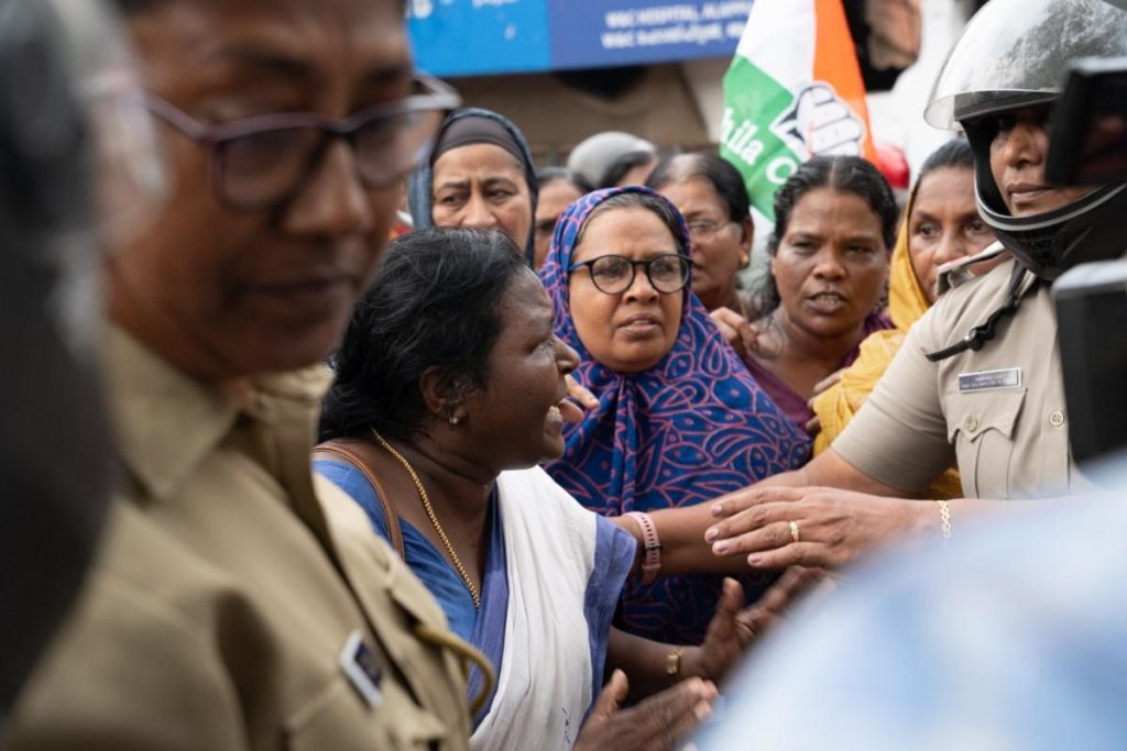 Rising tension women protesters confront police officers.