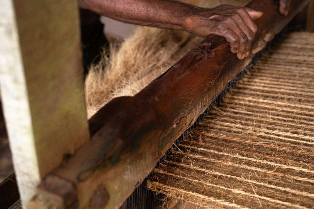 Rope Weaving Machine weaving coconut fiber into ropes.